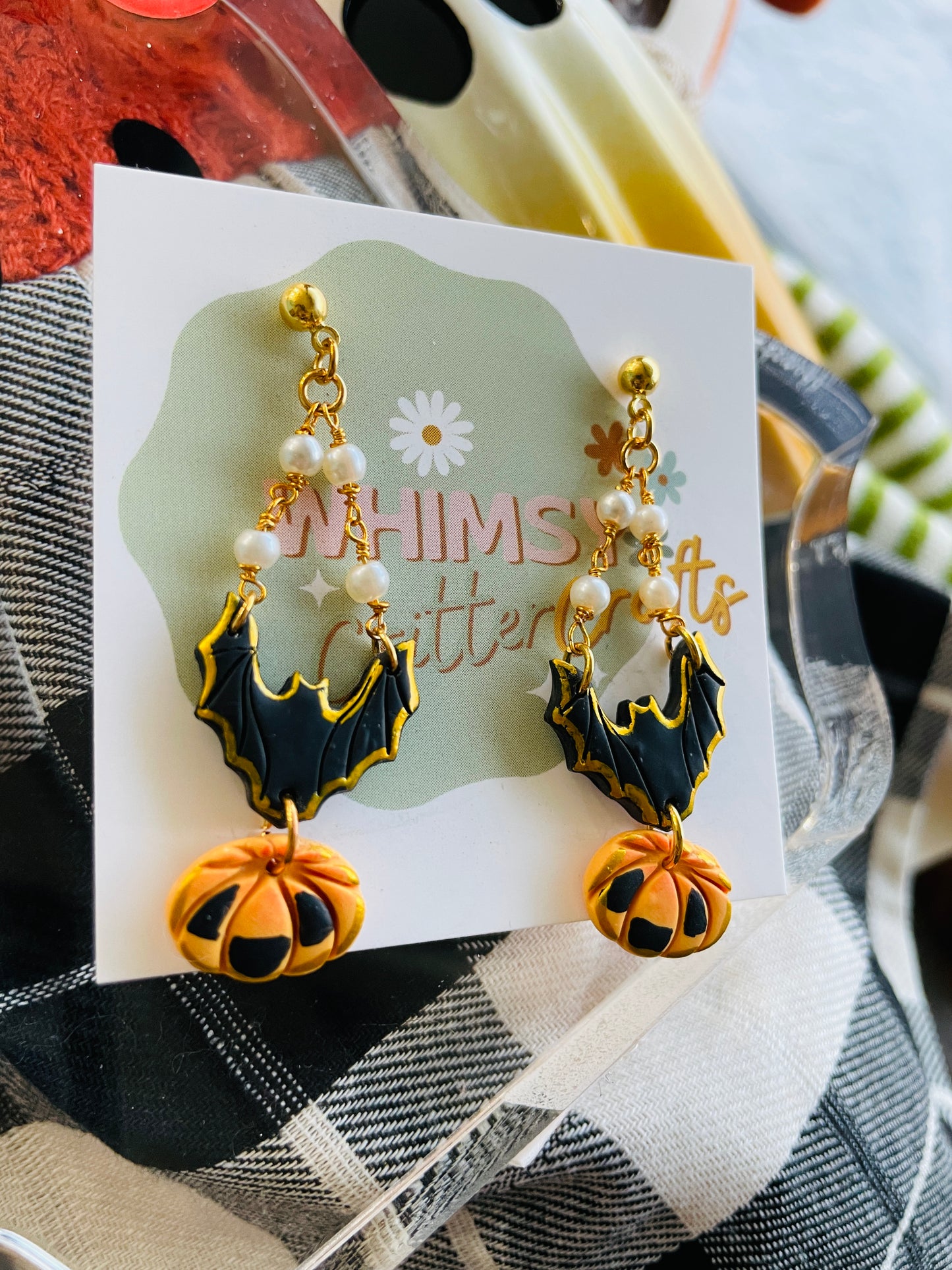 sleek black bat earrings